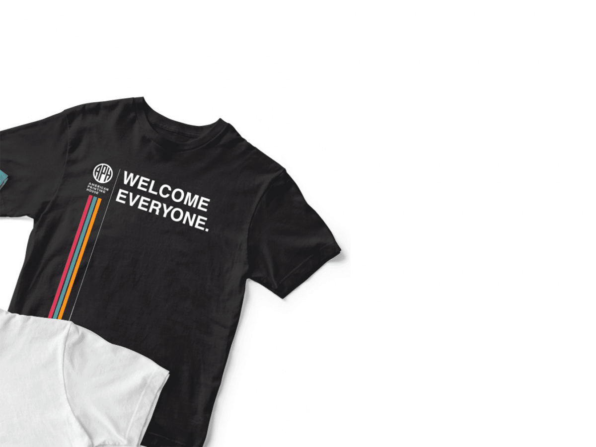 A t-shirt reads "Welcome Everyone" and sits against a white background