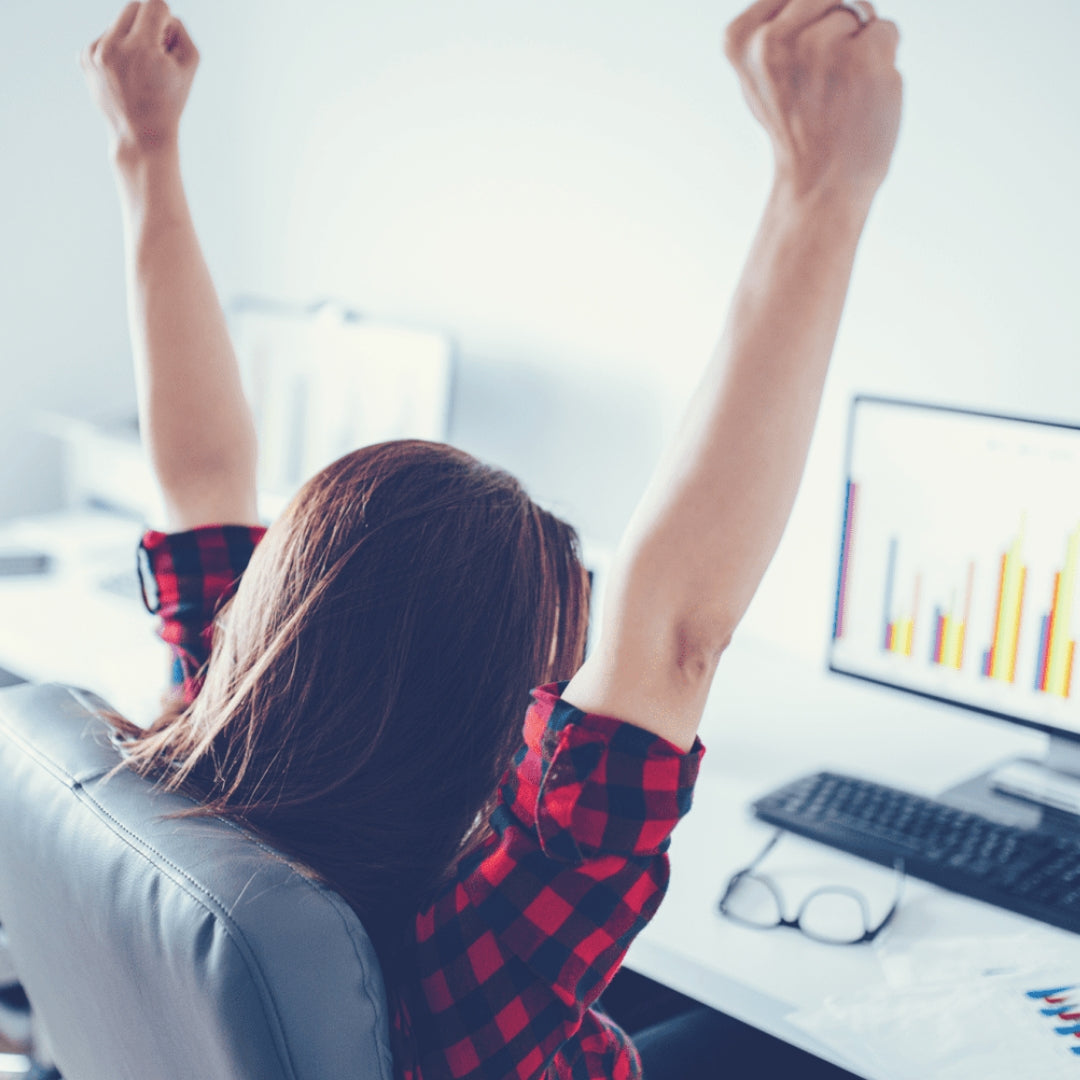 Woman sits at a computer