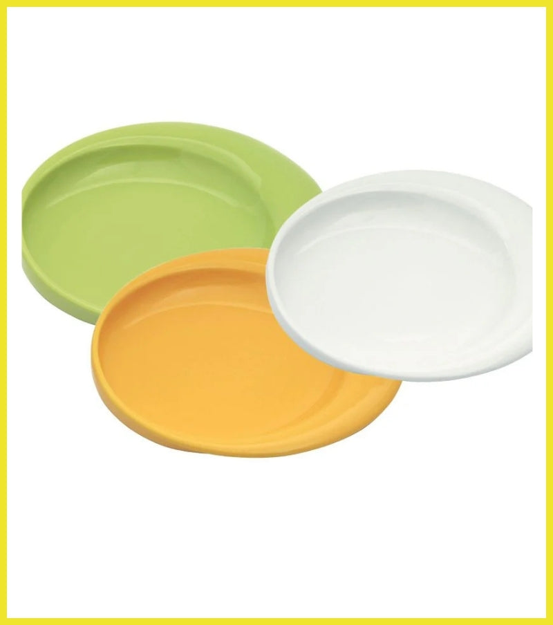 Three colorful plates in green, orange, and white on a white background