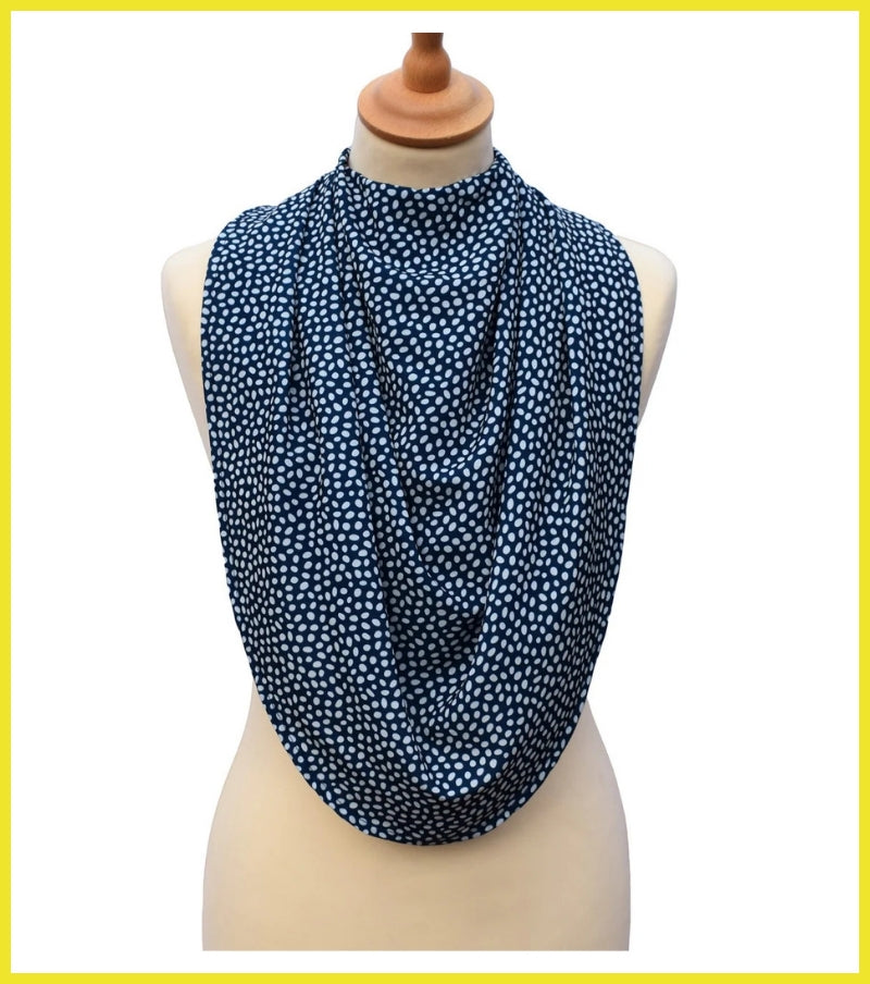 Navy blue patterned scarf on a mannequin with a white background