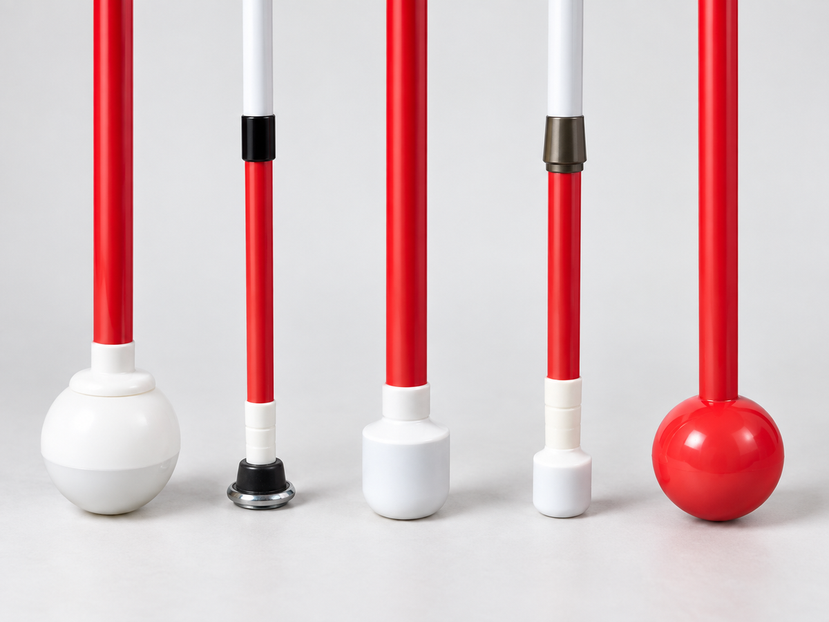 Showing a collection of five different mobility cane tips.