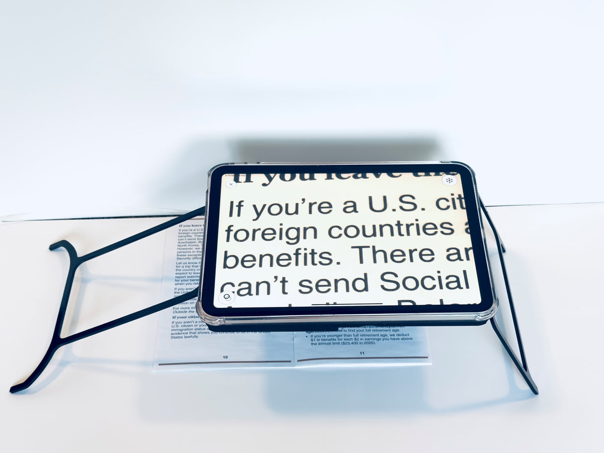 Case resting on a newspaper with text about U.S. citizenship benefits.
