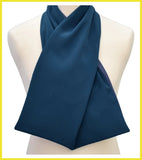 Navy blue scarf draped over a mannequin on a white background