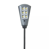 LED light with flexible black cable on a white background