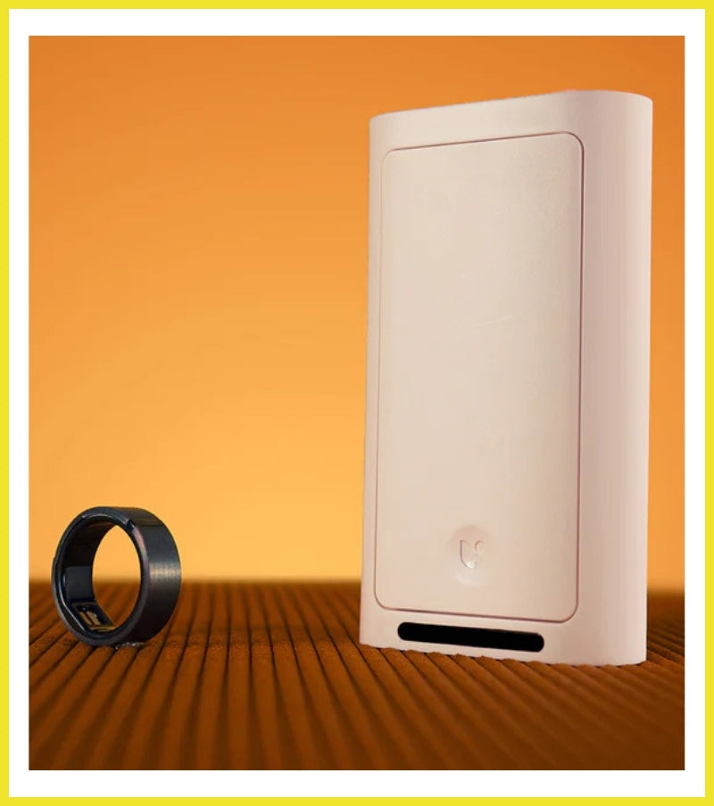 White electronic device with a black ring on an orange background
