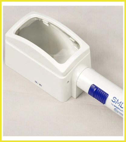 White electronic device with a blue component on a beige background