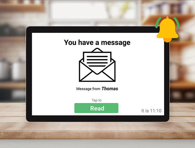 Digital tablet with a message notification on a wooden surface