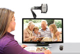 Woman looking at pictures using Acrobat HD ultra Electronic Magnifier