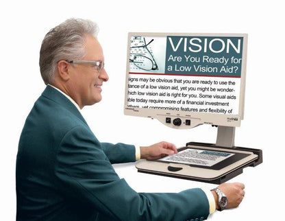 Man using Merlin Ultra to look at brochures