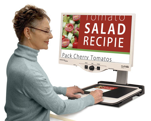 Woman using Merlin Ultra to view recipes